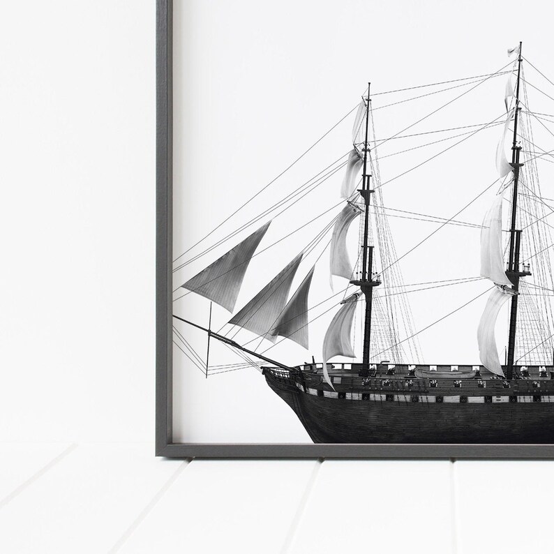 May include: Black and white illustration of a sailing ship with multiple sails. The ship is drawn in detail with ropes and rigging.