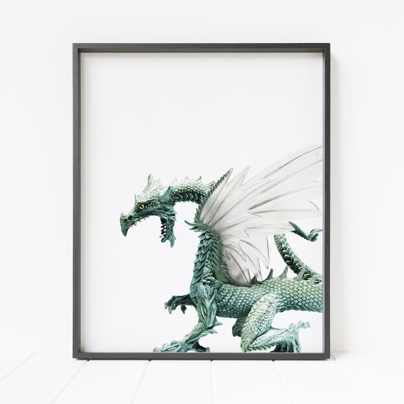 May include: A green dragon with white wings is posed in a standing position with its head turned to the side. The dragon has a textured, scaly body and a long tail.