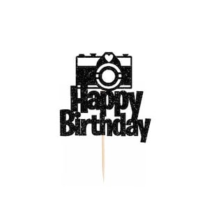 May include: Black glitter cake topper with a camera silhouette and the text "Happy Birthday".