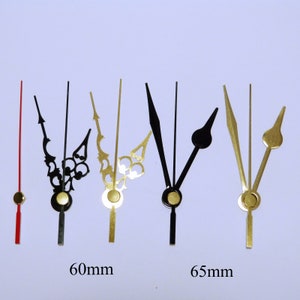 K&ouml;nnte beinhalten: Sortiment von Uhrzeigern in Schwarz und Gold. Die Zeiger sind 60 mm und 65 mm lang.