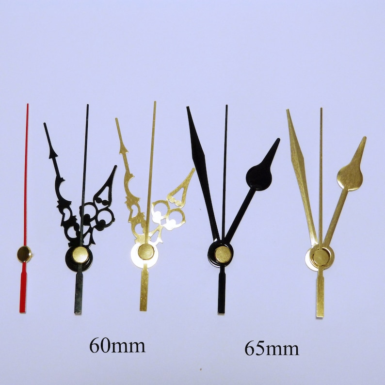 K&ouml;nnte beinhalten: Sortiment von Uhrzeigern in Schwarz und Gold. Die Zeiger sind 60 mm und 65 mm lang.