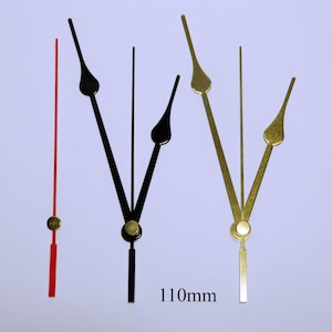 K&ouml;nnte beinhalten: Drei Uhrzeiger, einer rot, einer schwarz und einer goldfarben, mit einer L&auml;nge von 110 mm. Die Zeiger sind f&uuml;r die Verwendung in einer Uhr bestimmt.