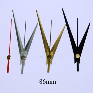 K&ouml;nnte beinhalten: Vier Uhrzeiger in verschiedenen Farben: Rot, Silber, Gold und Schwarz. Die Zeiger sind 86 mm lang und haben eine spitze Spitze.