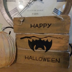Happy Halloween with a bat  distressed wood sign