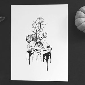 May include: Monochrome illustration featuring a skull with a snail, roses, and dripping ink. A small pumpkin and crystals are also in the image. The artwork is on a white background.