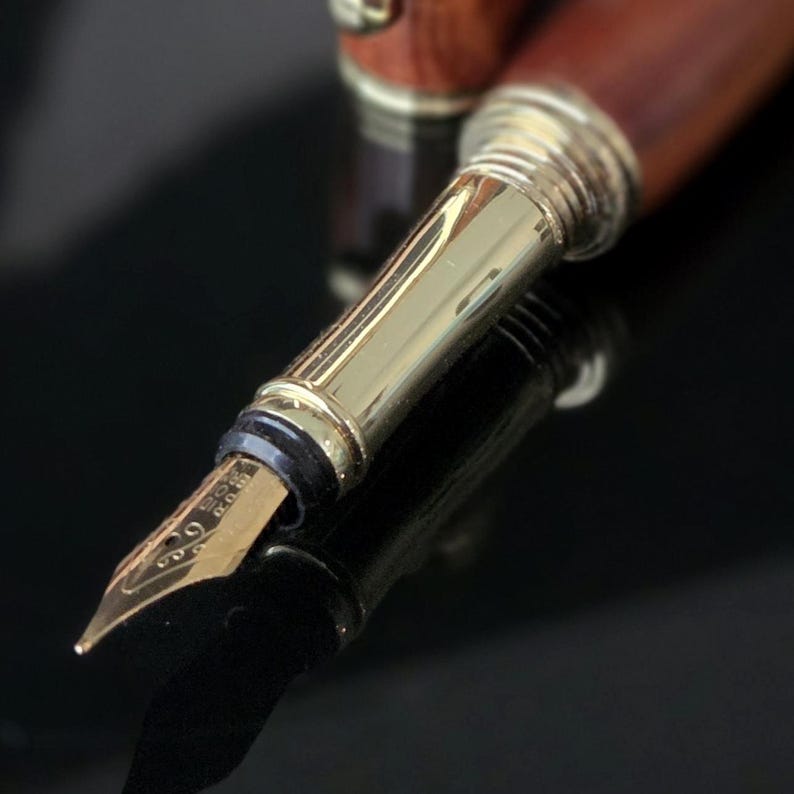 Close up of nib end of a model 355 fountain pen made from Rosewood