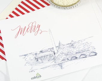May include: White greeting card with a pen and ink illustration of Washington D.C. landmarks, including the Washington Monument and a bridge. The word "Merry" is written in red script. The card is part of a set with a red and white striped envelope.