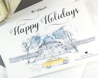 May include: Holiday greeting card with the words "Happy Holidays" in elegant script. The card features a detailed illustration of a domed building, trees, and a yellow car. The names "The Tanners" are printed below the illustration.