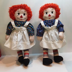 A PAIR of Vintage Raggedy Ann dolls