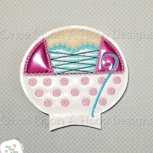 May include: Embroidered applique design of a white and pink polka dot hot air balloon with a pink and teal bodice and a teal swirl.
