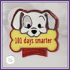May include: Embroidered patch featuring a cartoon Dalmatian dog holding a yellow bone with the text "101 days smarter".