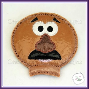 May include: Embroidered patch of Mr. Potato Head's face. The patch is brown with a black mustache, brown nose, and black eyes. The eyes are white with black pupils.