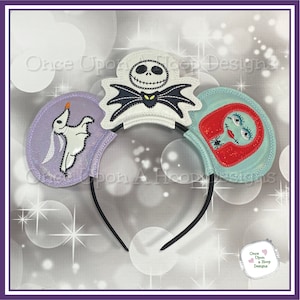 May include: A pair of black mouse ears with three embroidered patches. The left ear features a purple patch with a white ghost dog, the right ear features a blue patch with a red character with a spider, and the center ear features a white patch with a black and white character with a black bat.