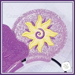 May include: Purple glitter Minnie Mouse ears with a yellow embroidered sun with a purple swirl in the center.
