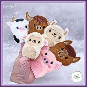 May include: Five felt finger puppets of farm animals: a cow, a bull, a sheep, a horse, and a pig. The puppets are all in different colors and have embroidered faces.