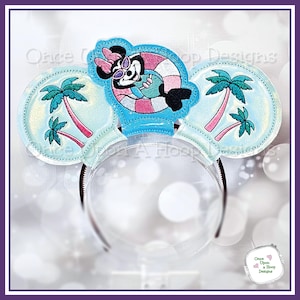 May include: A pair of blue and white mouse ears with a Minnie Mouse character wearing sunglasses and a pink and white inner tube. The ears have a palm tree design on each side.