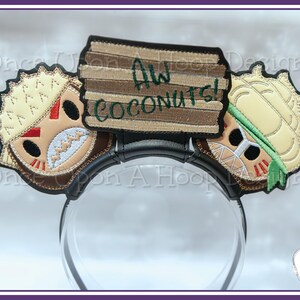 May include: A pair of brown and beige embroidered mouse ears with a sign that reads "Aw Coconuts!"  The ears are attached to a black headband.