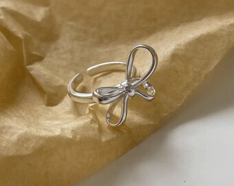 Ribbon Bow wrap around adjustable 925 sterling silver ring. Cute minimalist trendy Jewellery.