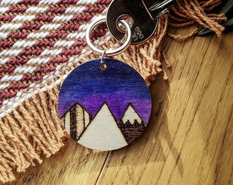 Wooden, handmade Mountain Keyring. Available in Blue, Pink, Purple, Blue and Natural.