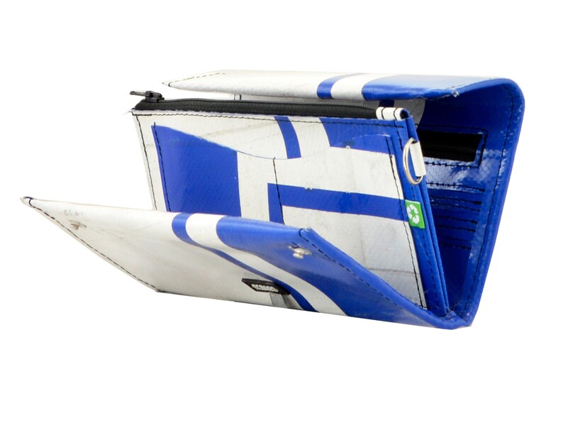 May include: A blue and white wallet made from recycled materials. The wallet has a zipper closure and a snap closure. The wallet is open and the inside is visible. The wallet has multiple compartments for cards and cash.