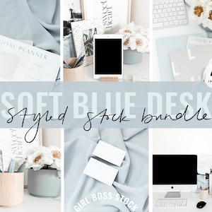 May include: A styled stock photo bundle featuring a soft blue desk with a computer, keyboard, mouse, pens, a goal planner, and white flowers. The text "SOFT BLUE DESK Styled Stock Bundle" is displayed in the center of the image.