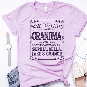 May include: A light purple t-shirt with a black and white graphic that says "Proud to be called Grandma to these awesome kids Sophia, Bella, Jake & Connor".