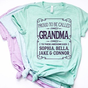 May include: A light green t-shirt with a white text overlay that reads "Proud to be called Grandma to these awesome kids Sophia, Bella, Jake & Connor".