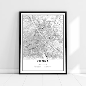 May include: Black and white map print of Vienna, Austria. The map shows the city streets and the Danube River. The text "VIENNA" and "AUSTRIA" is printed below the map, along with the coordinates "48.2082°N 16.3738°W".