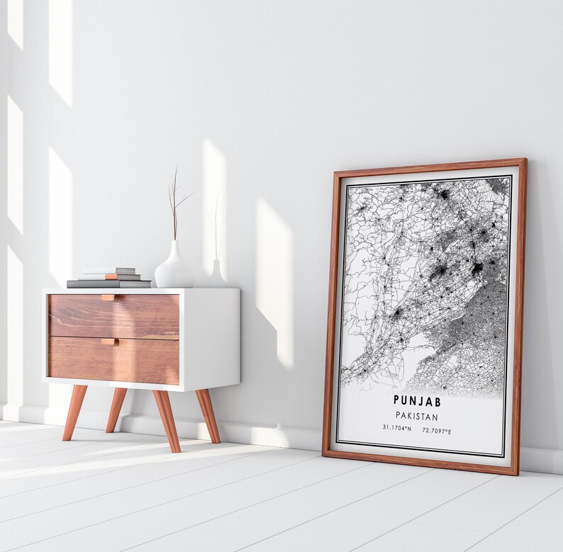 May include: A framed black and white map of Punjab, Pakistan, with the text "Punjab Pakistan 31.1704&deg;N 72.7097&deg;E" printed below the map.