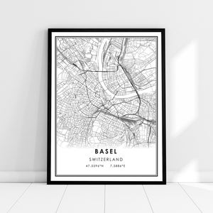 May include: Black and white map print of Basel, Switzerland. The map shows the city streets and waterways. The text "Basel, Switzerland" and the coordinates "47.5596°N 7.5886°E" are printed below the map.