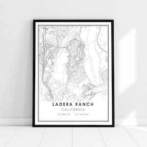 May include: Black and white line art map print of Ladera Ranch, California. The map shows the streets and neighborhoods of the city. The text "Ladera Ranch, California" and the coordinates "33.5507°N 117.6412°W" are printed below the map.