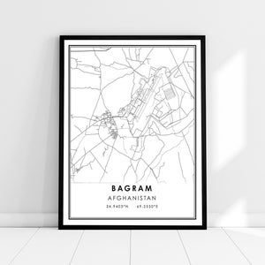 May include: Black and white line art map of Bagram, Afghanistan. The map shows the city's streets and roads, as well as the location of the Bagram Airfield. The map is framed in a black frame.