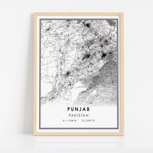 May include: A black and white map of Punjab, Pakistan, with a detailed road network. The map is framed in a light wood frame. The text "PUNJAB PAKISTAN 31.1704&deg;N 72.7097&deg;E" is printed below the map.