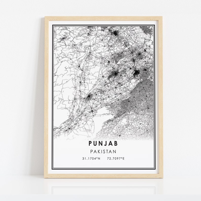 May include: A black and white map of Punjab, Pakistan, with a detailed road network. The map is framed in a light wood frame. The text "PUNJAB PAKISTAN 31.1704&deg;N 72.7097&deg;E" is printed below the map.