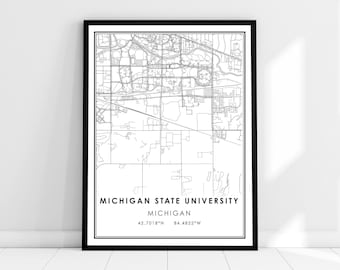 May include: Black and white line art map print of Michigan State University in East Lansing, Michigan. The print includes the university's name, the state, and the coordinates 42.7018°N 84.4822°W.
