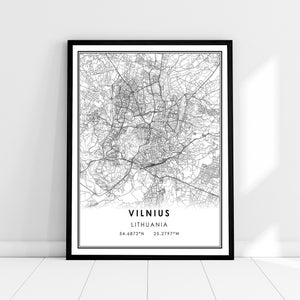 May include: Black and white map print of Vilnius, Lithuania. The map shows the city streets and landmarks. The text "Vilnius, Lithuania" and the coordinates "54.6872°N 25.2797°W" are printed below the map.