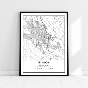 May include: Black and white map print of Gilroy, California. The map shows the city streets and surrounding area. The text "Gilroy, California" and the coordinates "37.0030°N 121.5566°W" are printed below the map.