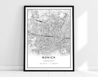 May include: Black and white map print of Munich, Germany with the city name and coordinates "48.1351°N | 11.5820°W" printed below the map.