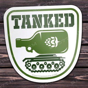 May include: Green and white sticker with the word "TANKED" in green letters. A green beer bottle with a hop is on top of a green tank with tracks. The text "207THREADS.COM" is at the bottom of the sticker.
