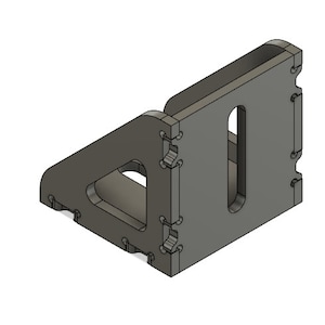 Peut inclure: Une équerre d'angle en plastique gris avec une forme triangulaire et une fente rectangulaire. L'équerre est dotée d'une série de languettes d'encliquetage sur les côtés.