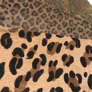 May include: A close-up of a brown and black leopard print fabric with a gold mesh fabric overlay.