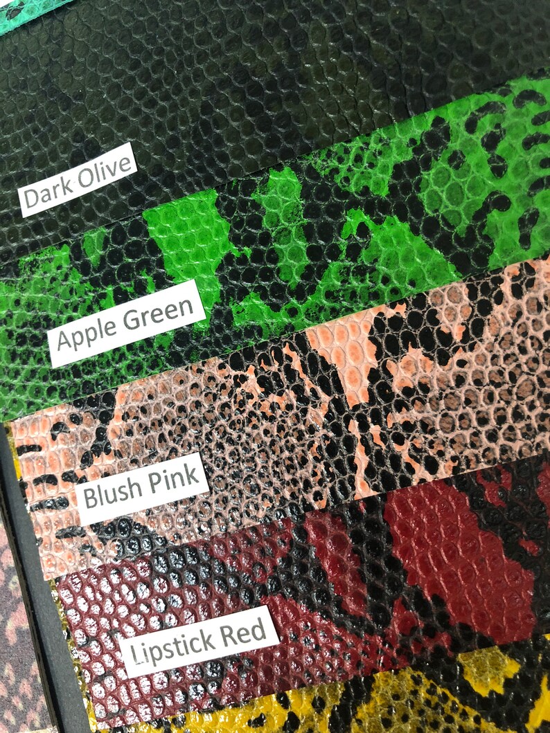 May include: Close-up of five different colored swatches of faux snakeskin fabric. The swatches are labeled "Dark Olive", "Apple Green", "Blush Pink", "Lipstick Red", and "Yellow".