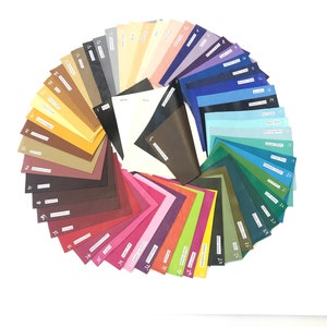 May include: A color chart with 39 different colors of paper. The colors are arranged in a circle, with the lightest colors at the top and the darkest colors at the bottom. The colors are labeled with numbers and names.