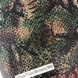 May include: Close-up of a fabric with a snakeskin pattern in shades of olive green, tan, brown, and black. The fabric is labeled "Olive/Tan/Brown/Blk".