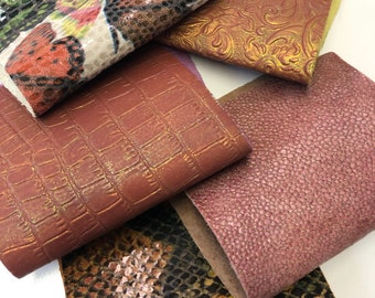 May include: Five different fabric swatches with various textures and patterns. The swatches include a floral pattern, a crocodile embossed pattern, a snakeskin pattern, a pink textured pattern, and a gold embossed floral pattern.