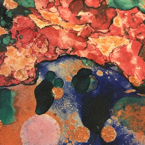 May include: Abstract art print with a colorful, marbled design. The print features shades of red, orange, green, blue, and gold.