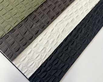 Auténtica piel de cocodrilo, cuero vacuno con relieve negro de lomo de cocodrilo. Elija entre láminas de cuero, pieles enteras o solicite un tamaño personalizado. Grosor: 3,5 oz.