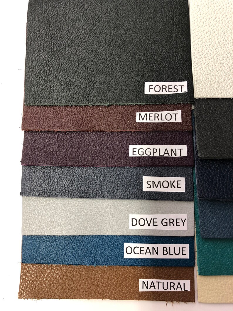 May include: A swatch card showing 10 different colors of leather. The colors are: Forest, Merlot, Eggplant, Smoke, Dove Grey, Ocean Blue, Natural, White, Teal, and Black.