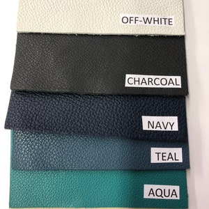 May include: Six fabric swatches in different colors, from top to bottom: off-white, charcoal, navy, teal, aqua, and cream.