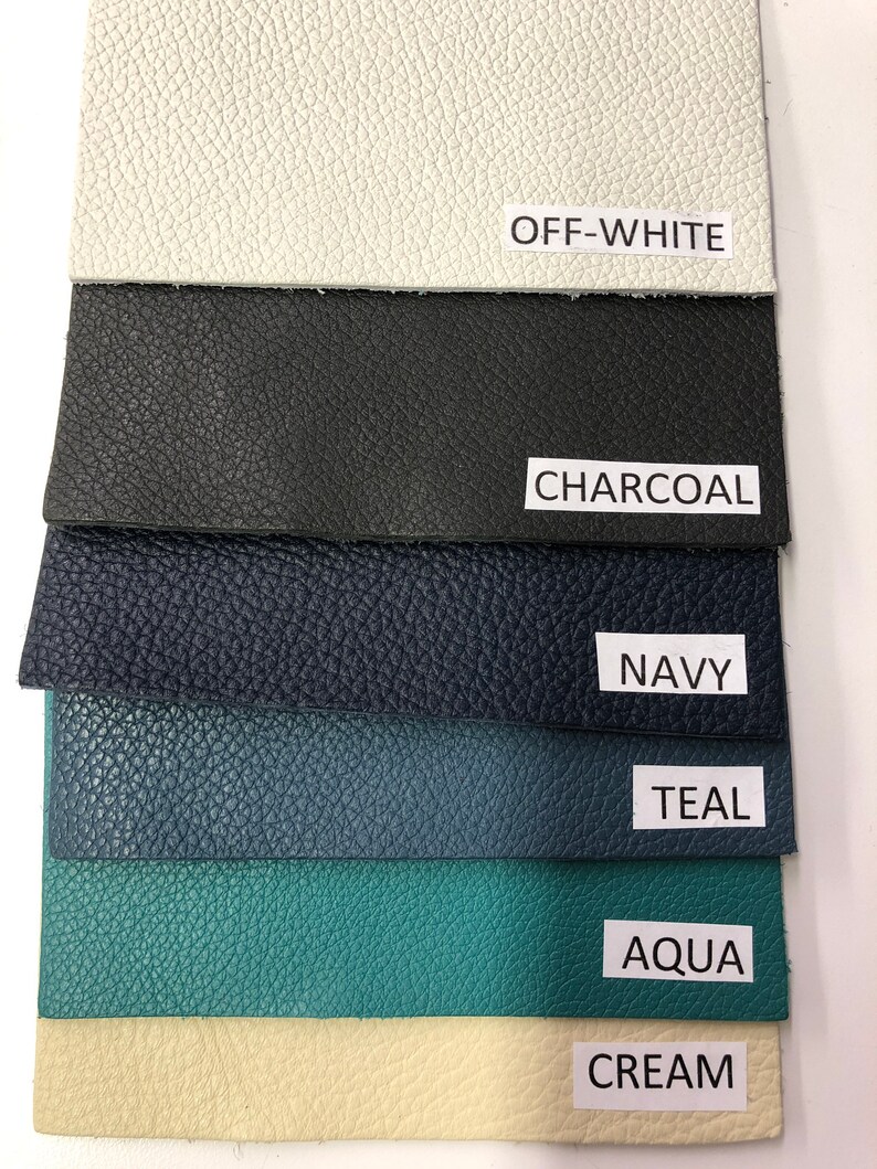 May include: Six fabric swatches in different colors, from top to bottom: off-white, charcoal, navy, teal, aqua, and cream.